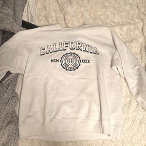 white crew neck with navy “california “ lettering